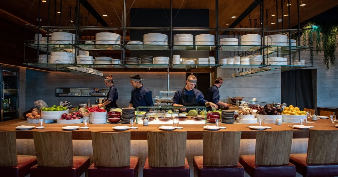 Chefs cooking in open kitchen