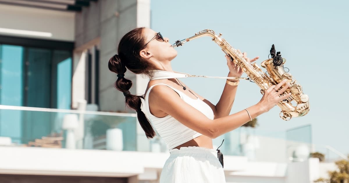A lady playing the saxophone 
