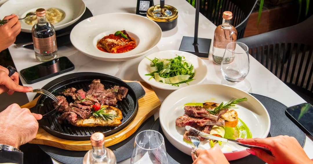Plates of Italian Cuisine food on a table