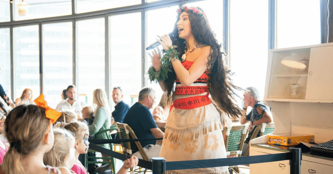 Lady singing to guests at The Scene