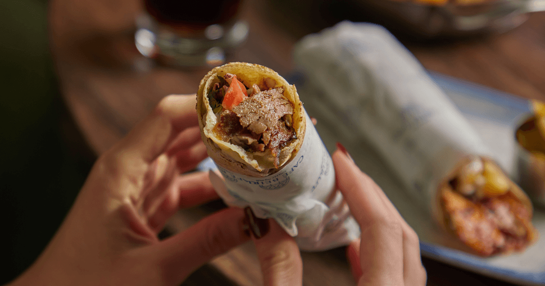 Lady Holding Chicken Shwarma