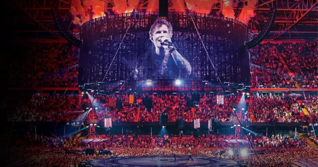 Ed Sheeran singing on stage