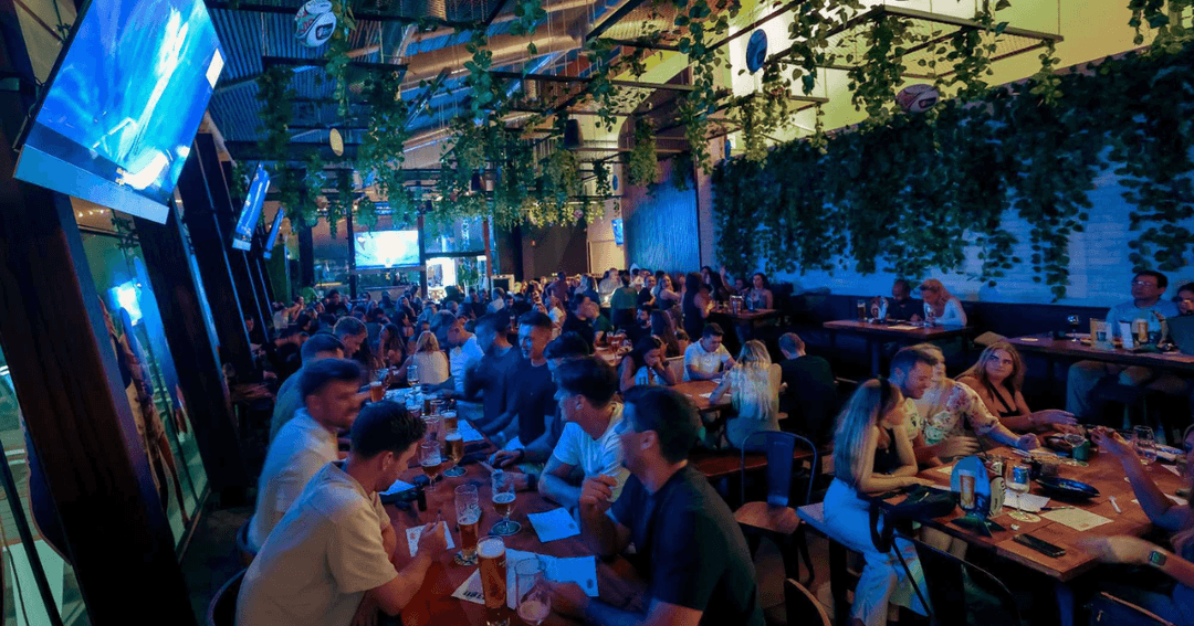 Guests playing quiz at a bar